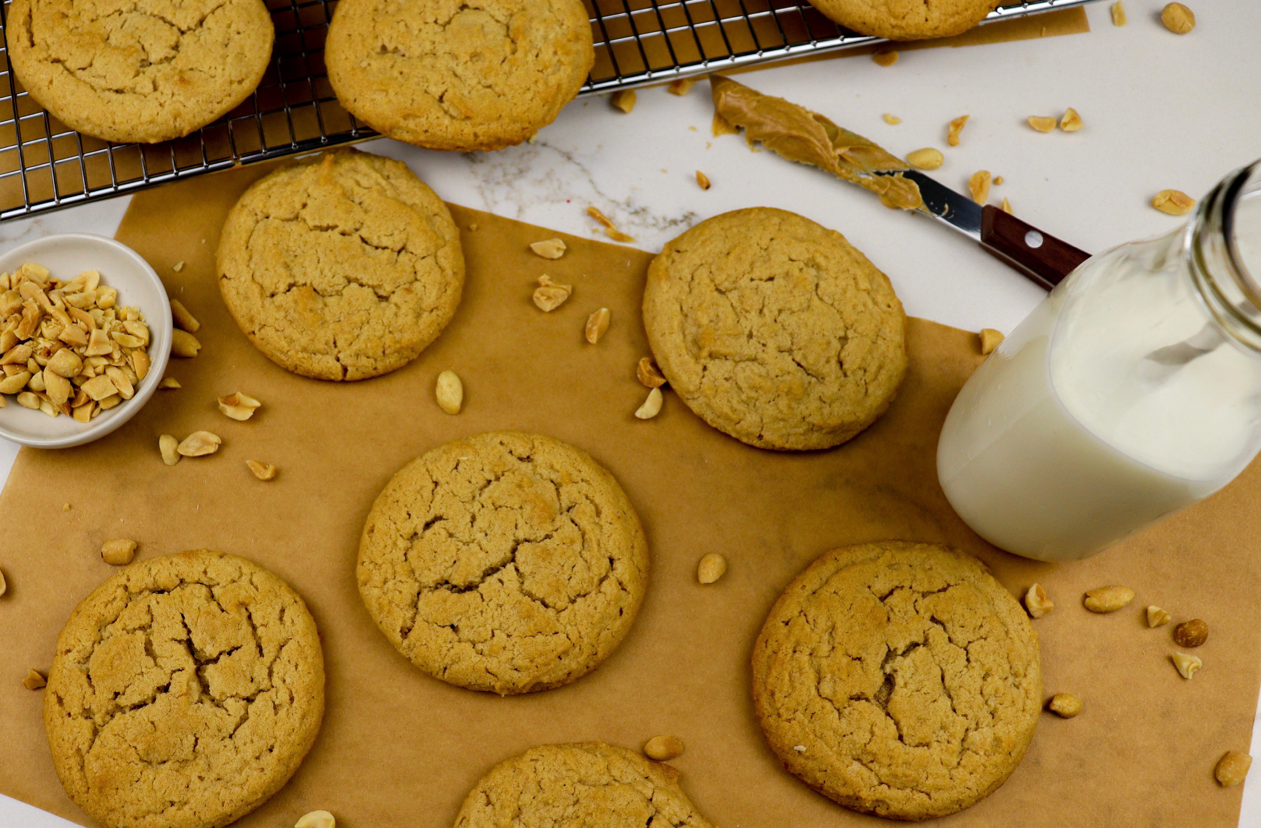 Freshly baked peanut butter cookies on parchment