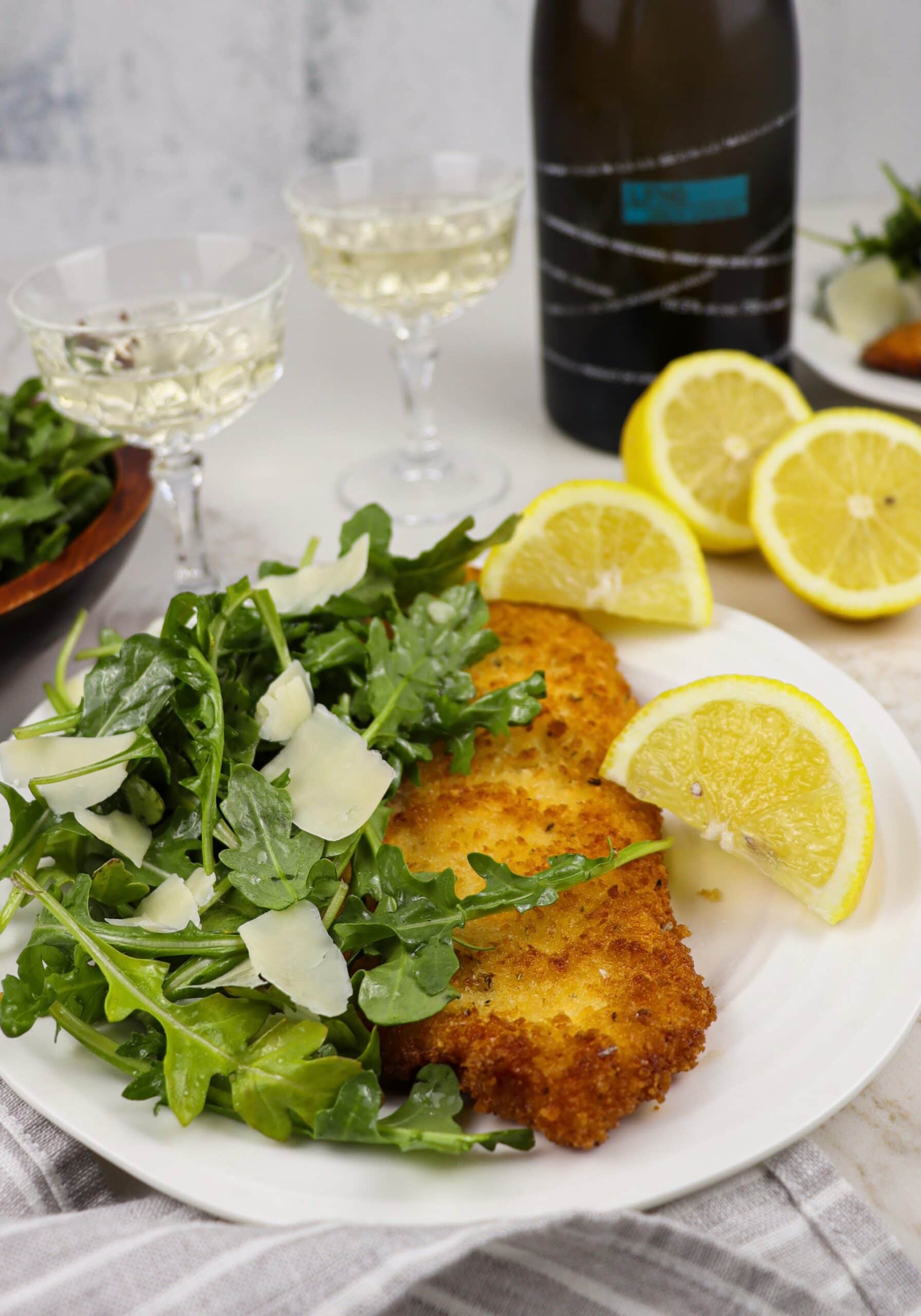 Chicken Milanese with bottle of white wine
