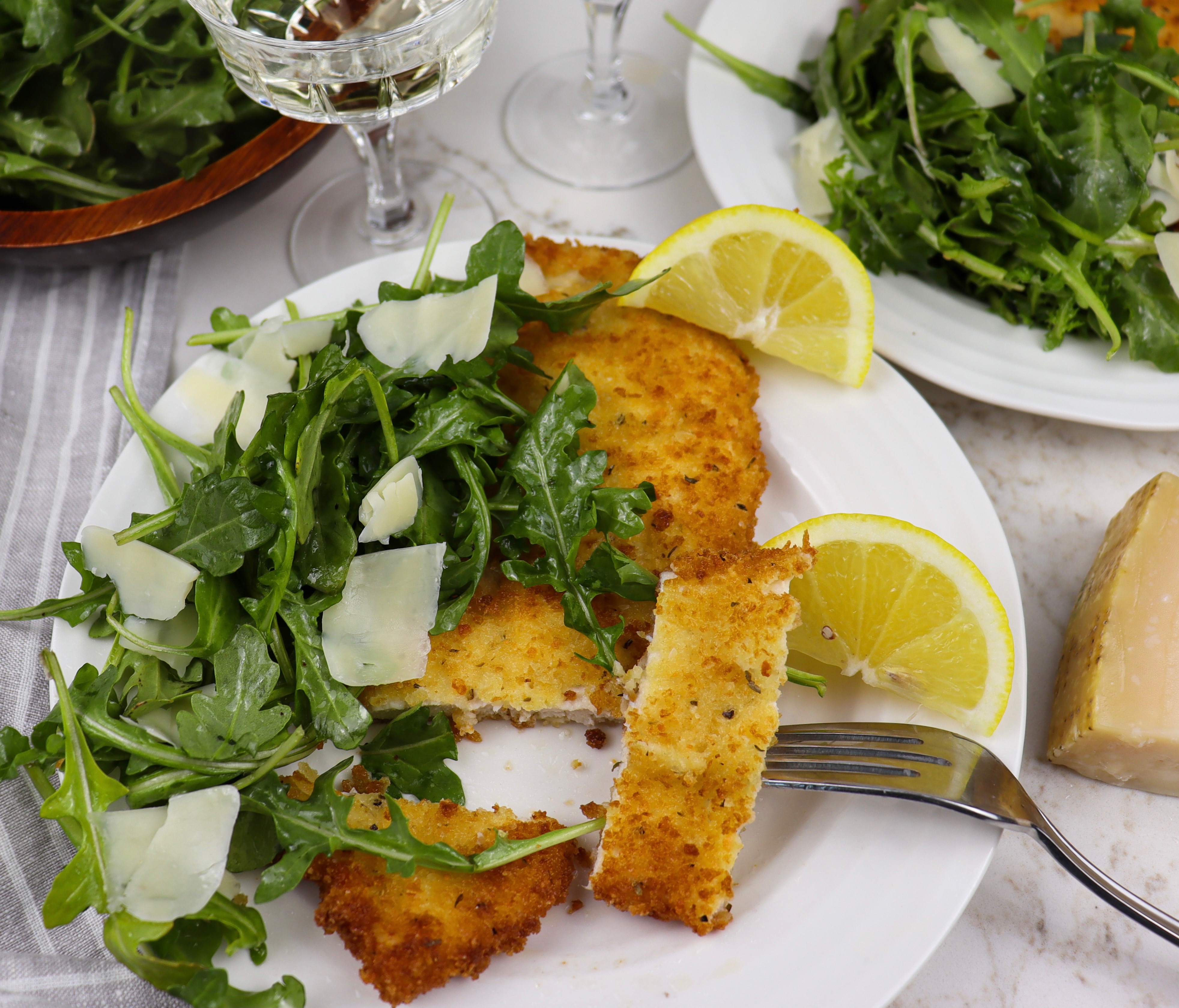 Plate of chicken milanese cut into pieces
