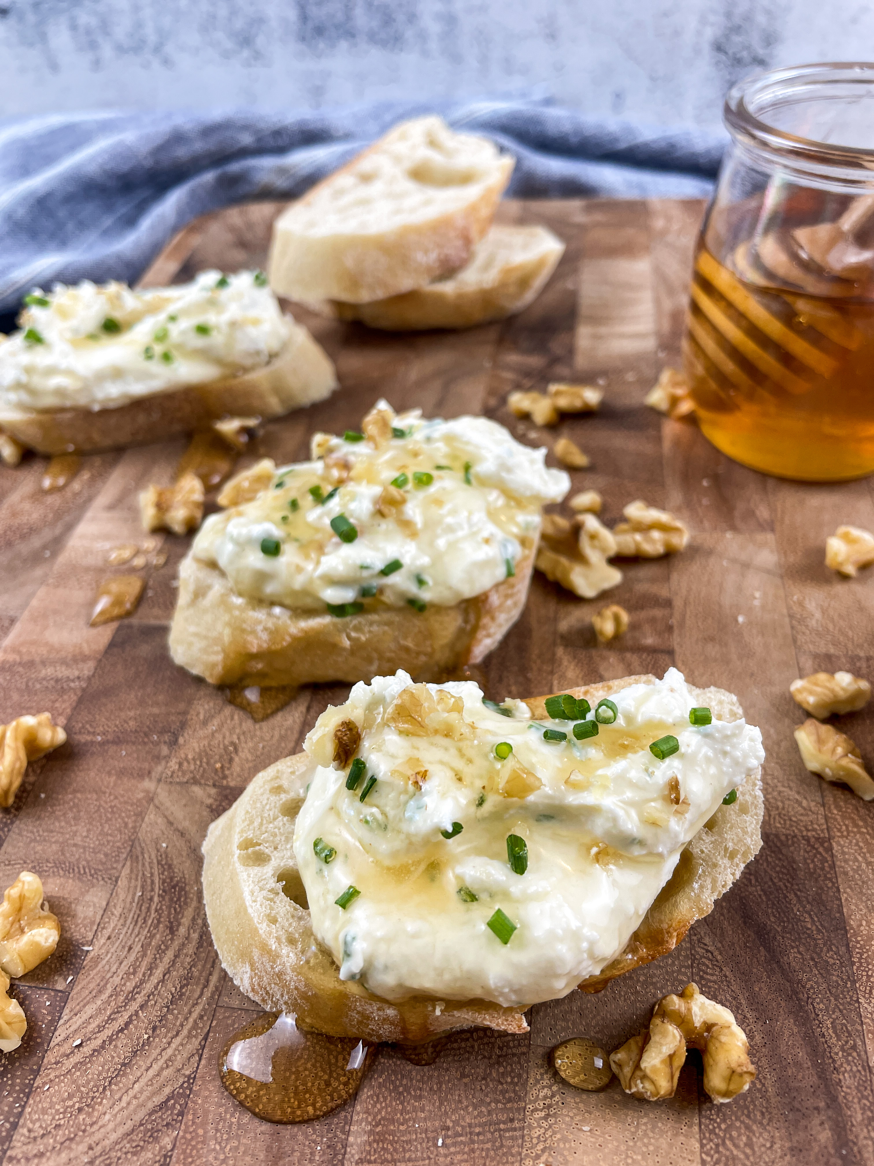 Pieces of bead slathered with whipped feta, honey and walnuts