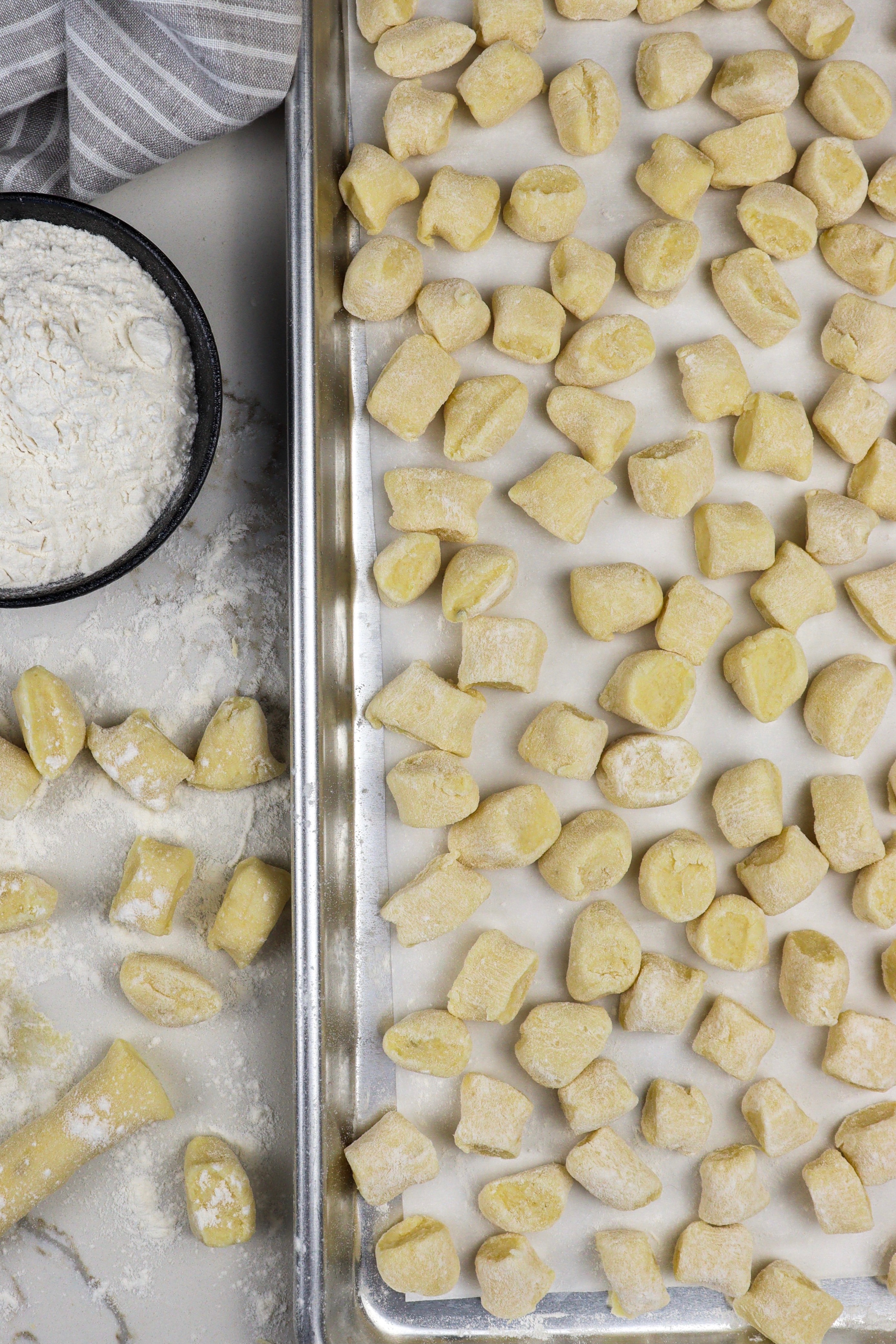 Homemade gnocchi placed on sheet pan