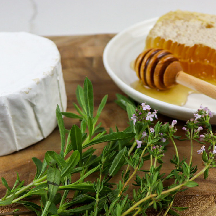 Brie cheese, fresh herbs, and honeycomb