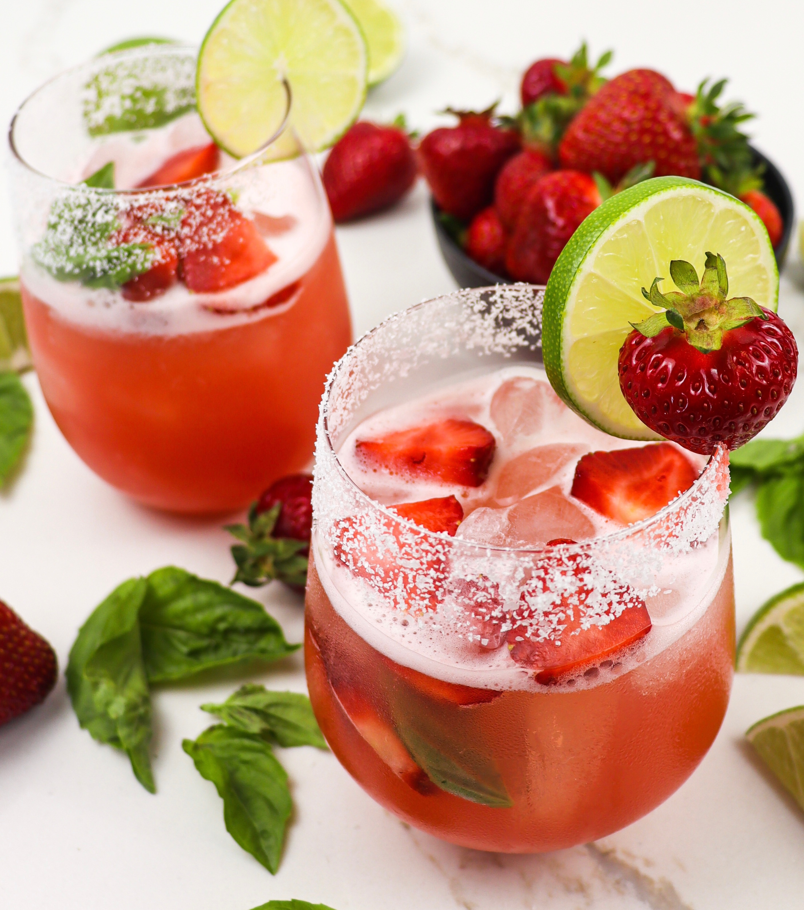 Two glasses of strawberry basil margarita
