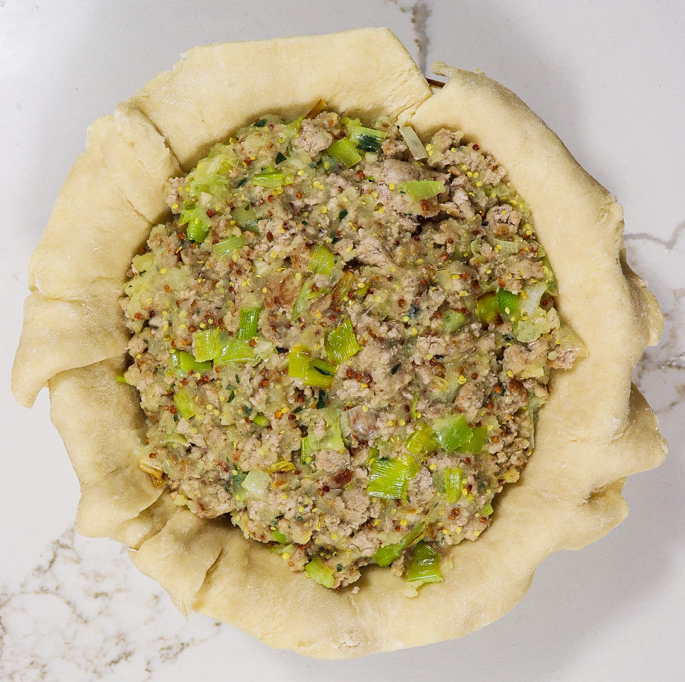 assembled pork leek potato pie before baking