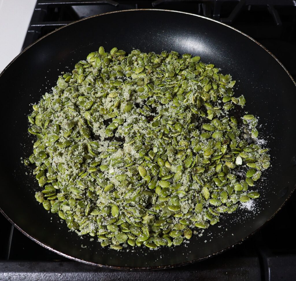 candied pumpkin seeds, spiced pear salad