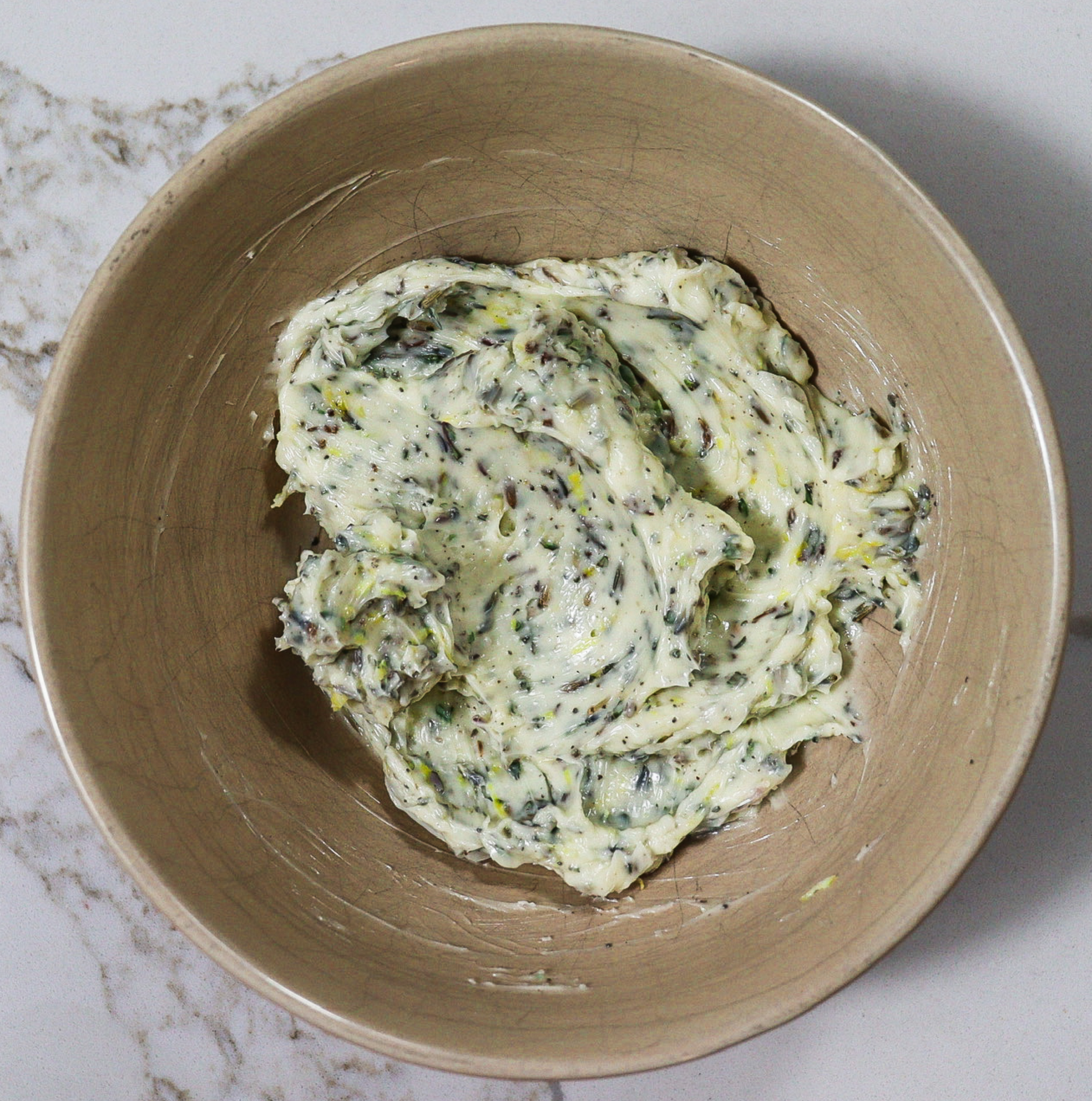 Compound butter with dried lavender, fresh thyme, lemon zest, salt and pepper