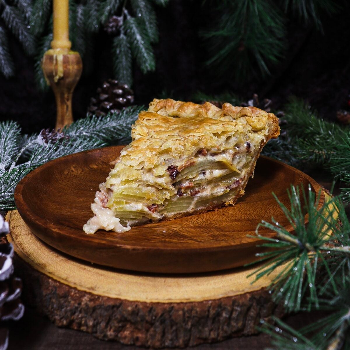 slice of potato bacon pie in a rustic setting