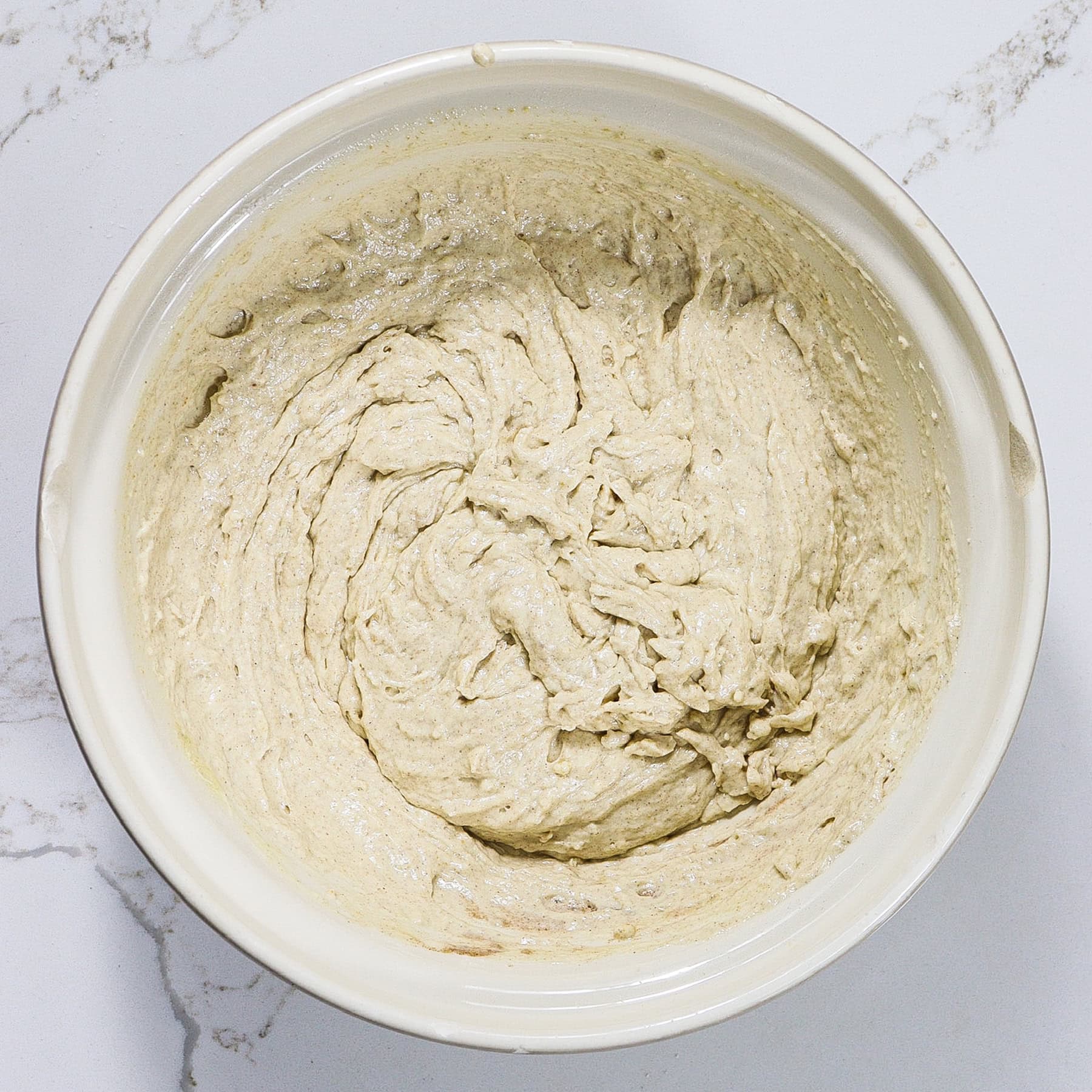 waffle batter mixed with meringue in a mixing bowl