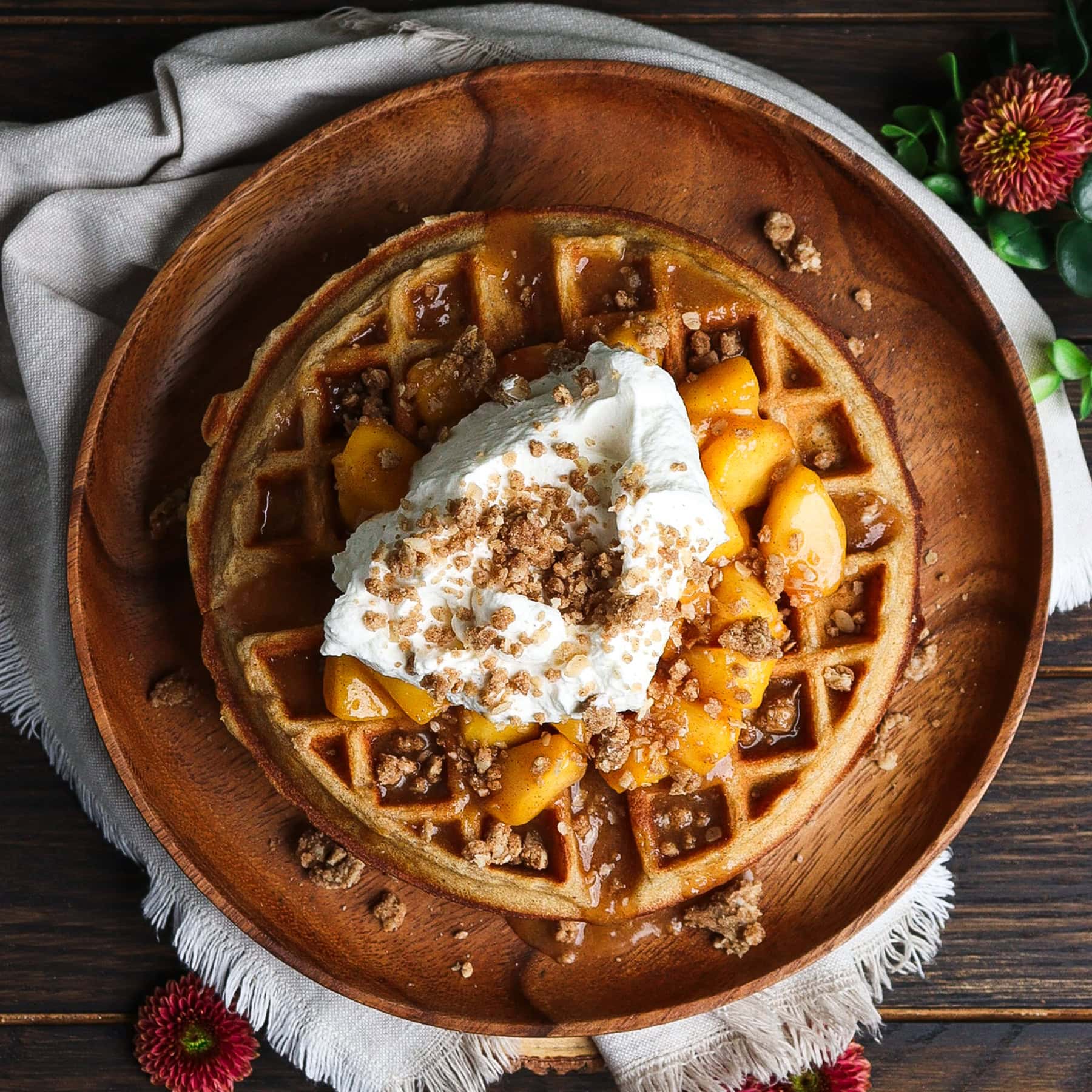 peach crisp waffles topped with whipped cream