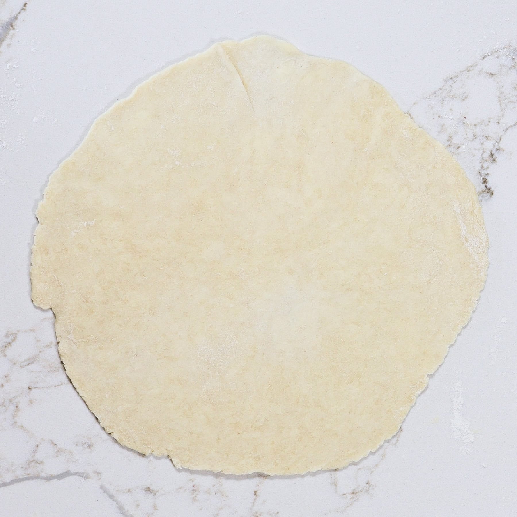 pie dough rolled into a circle for a galette crust
