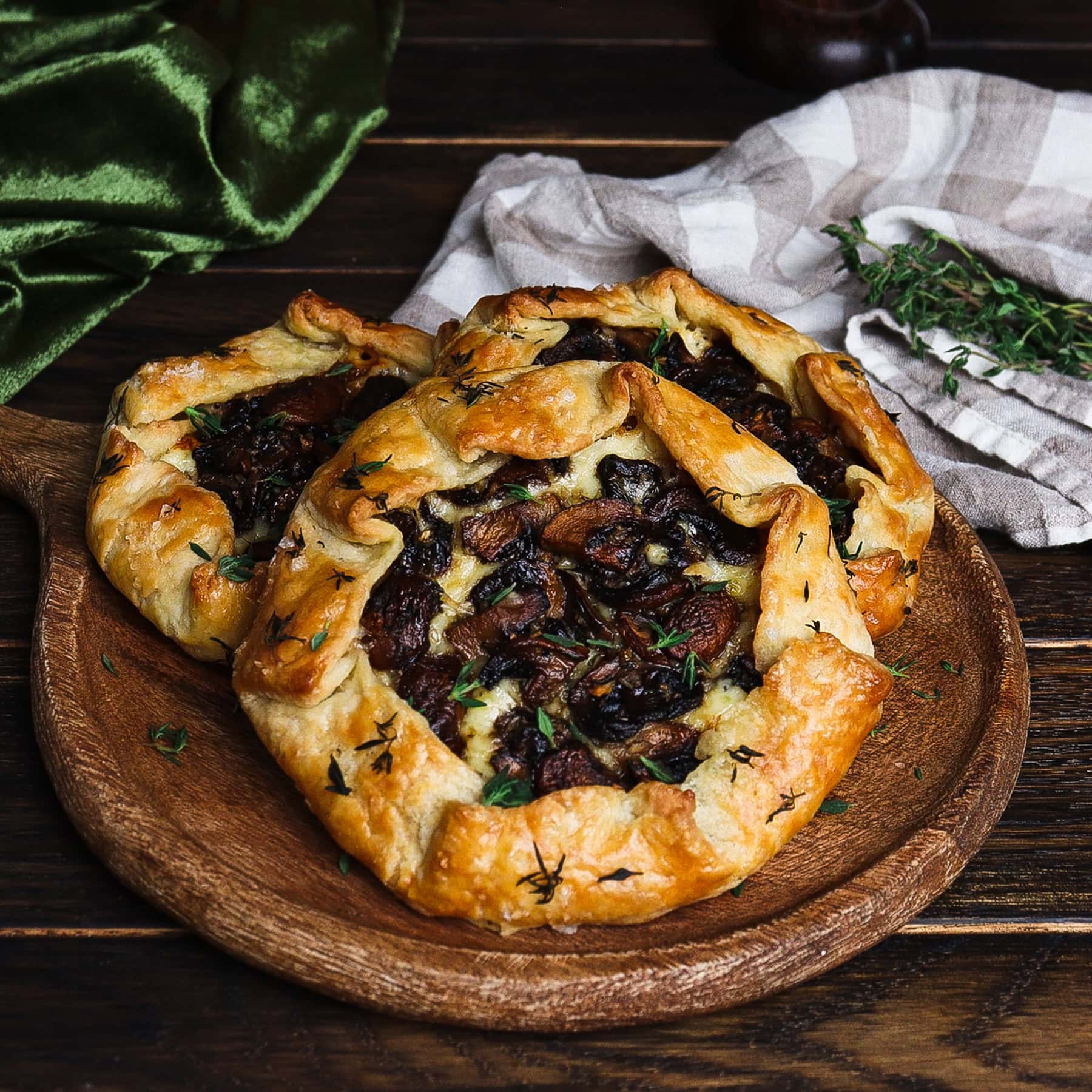 mini mushroom galettes on a rustic dish