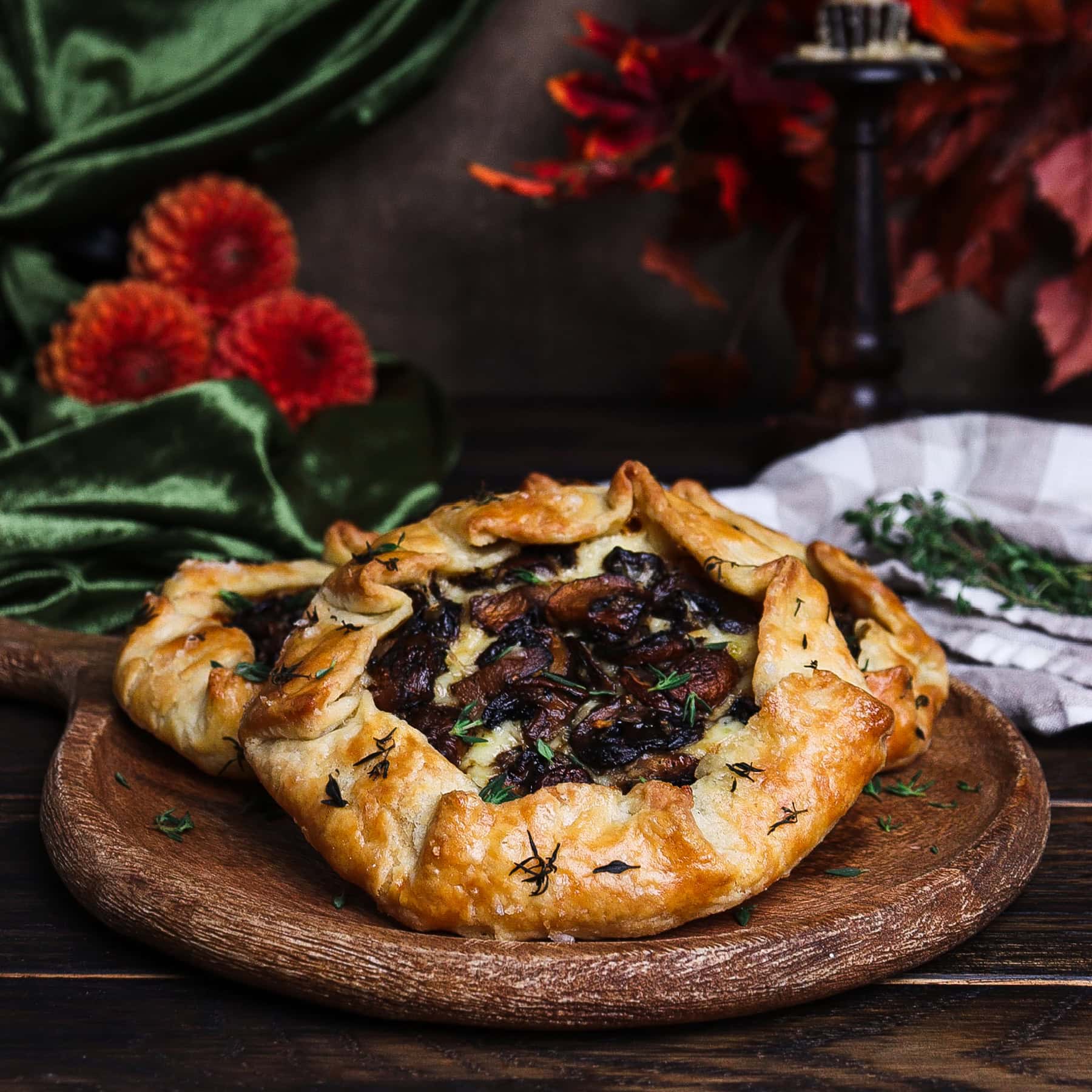 mini mushroom galettes on a rustic dish in a fall hobbit birthday setting
