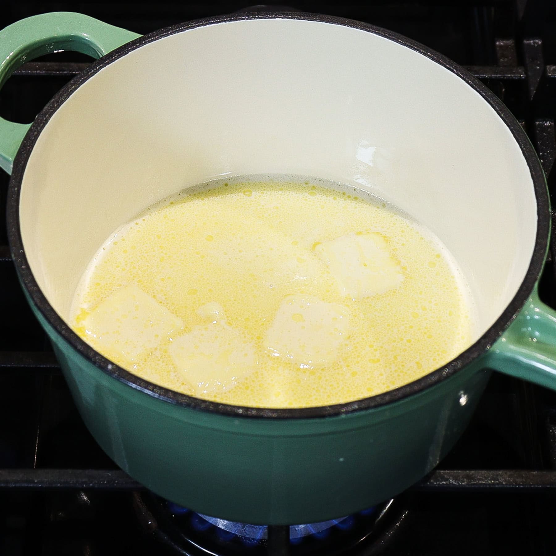 butter and heavy cream in a sauce on the stovetop