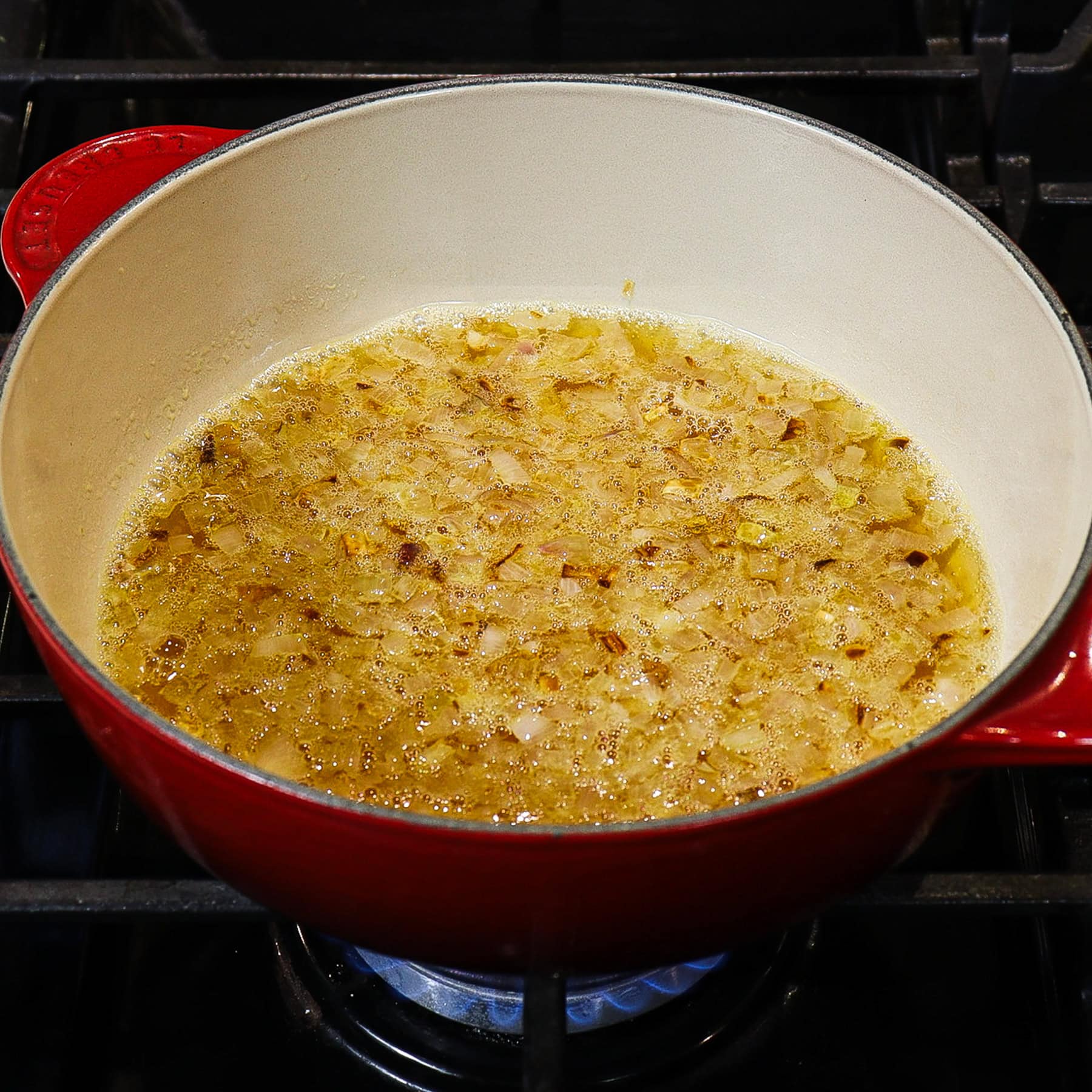 shallot and ale reduction in a saucepan
