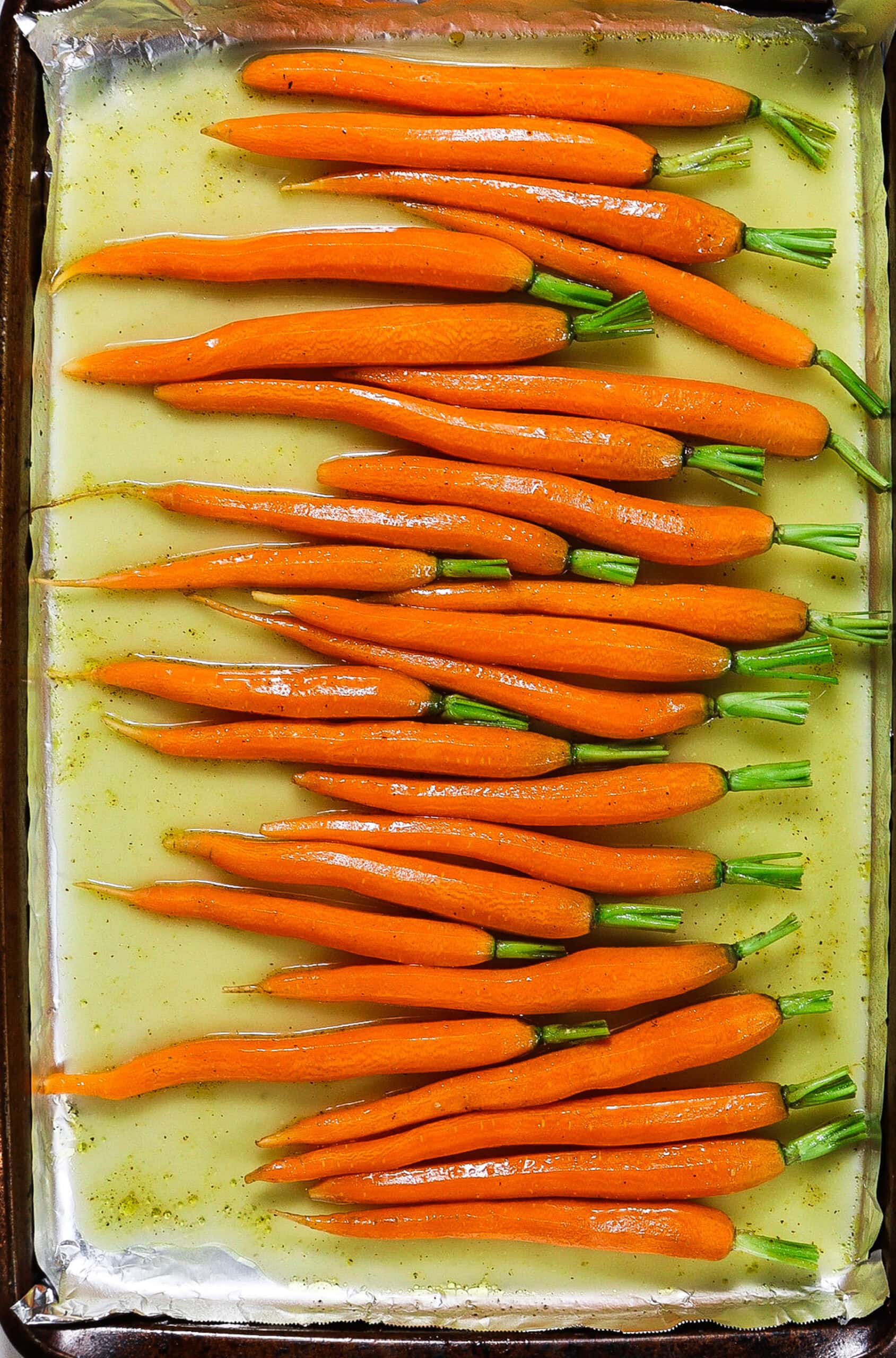 carrots in a cider glaze on a sheet pan