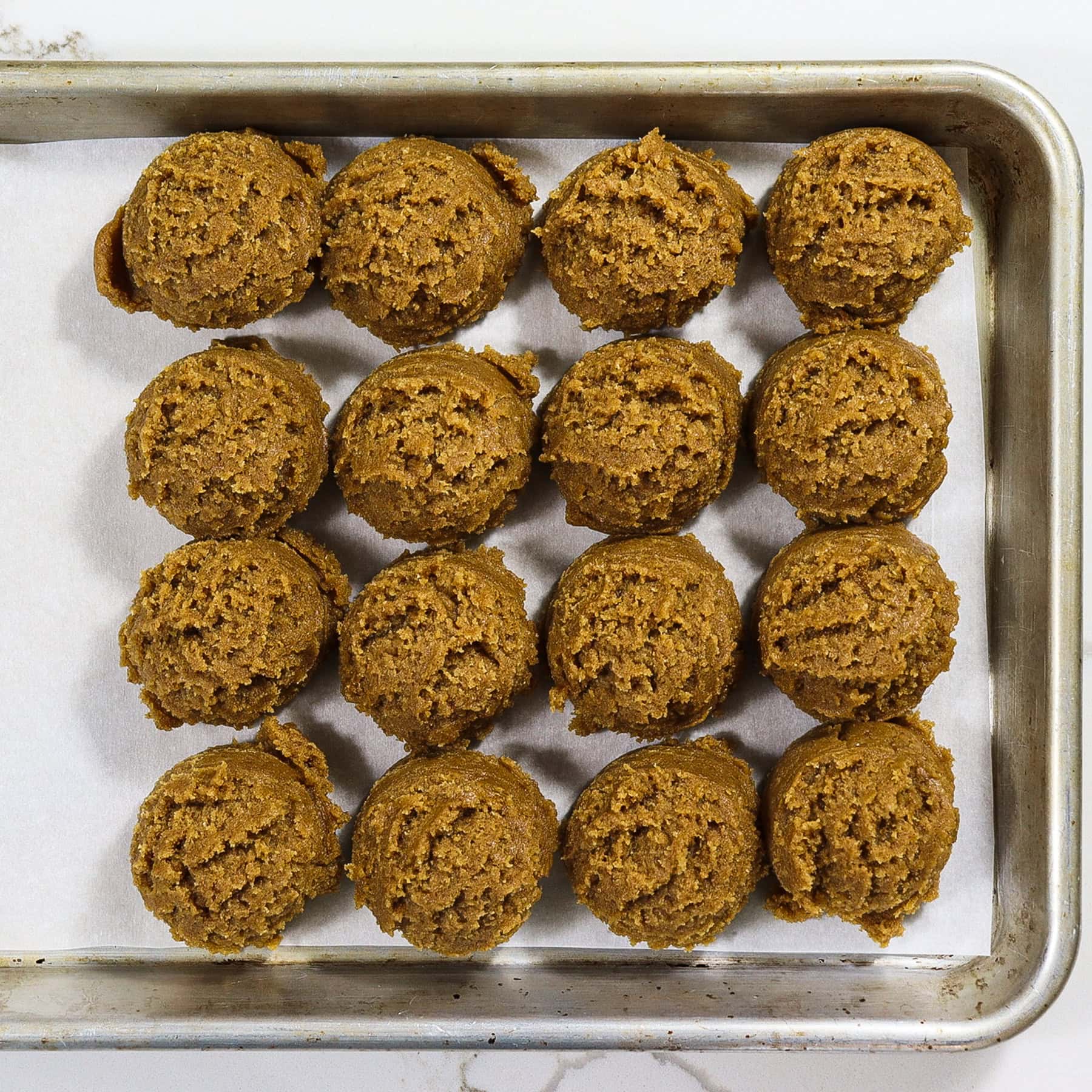 chewy pumpkin cookie dough on a sheet pan