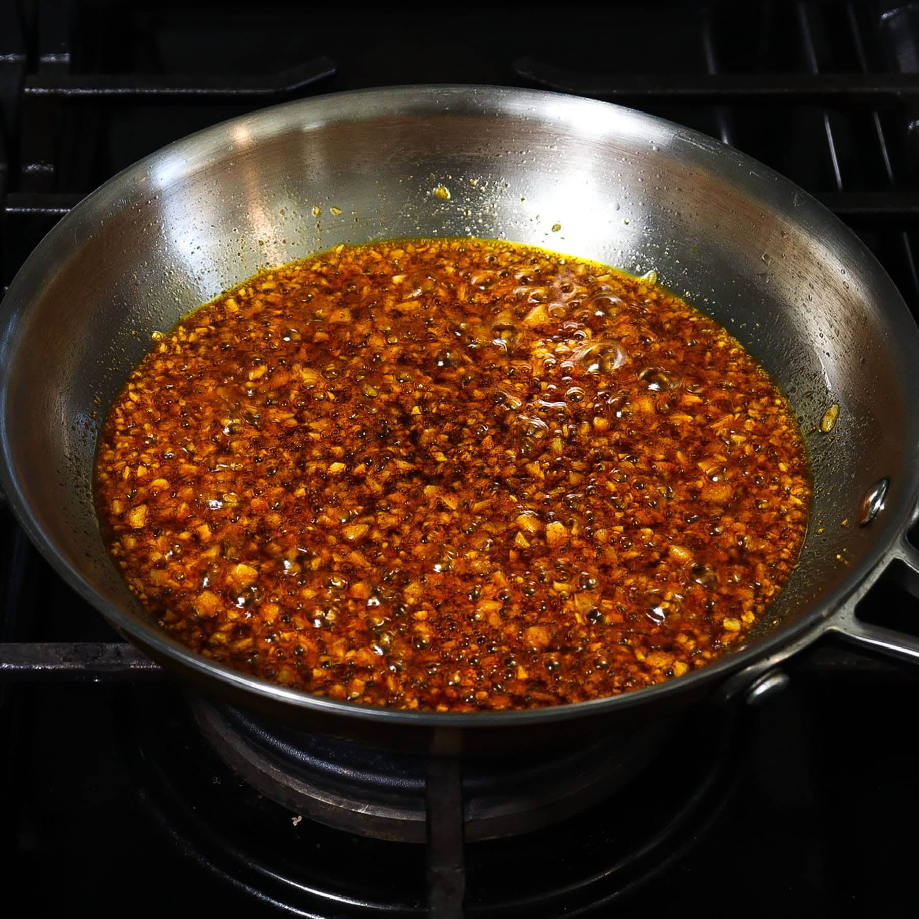 garlic and paprika sautéed in oil in a sauce pan