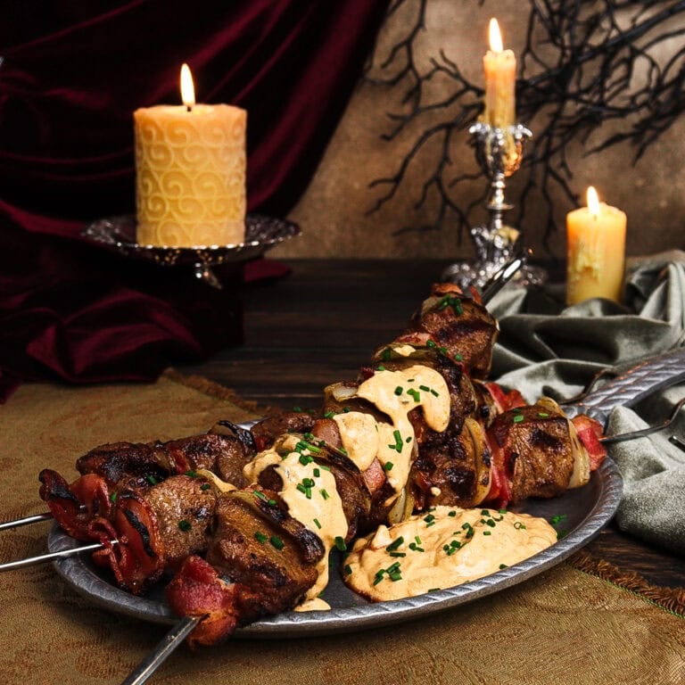 robber steak skewers on a pewter dish in a Dracula-inspired set