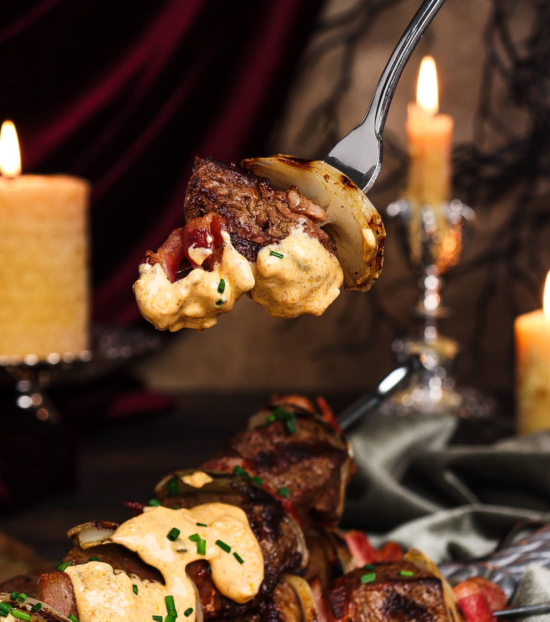 forkful of robber steak with garlic and paprika cream