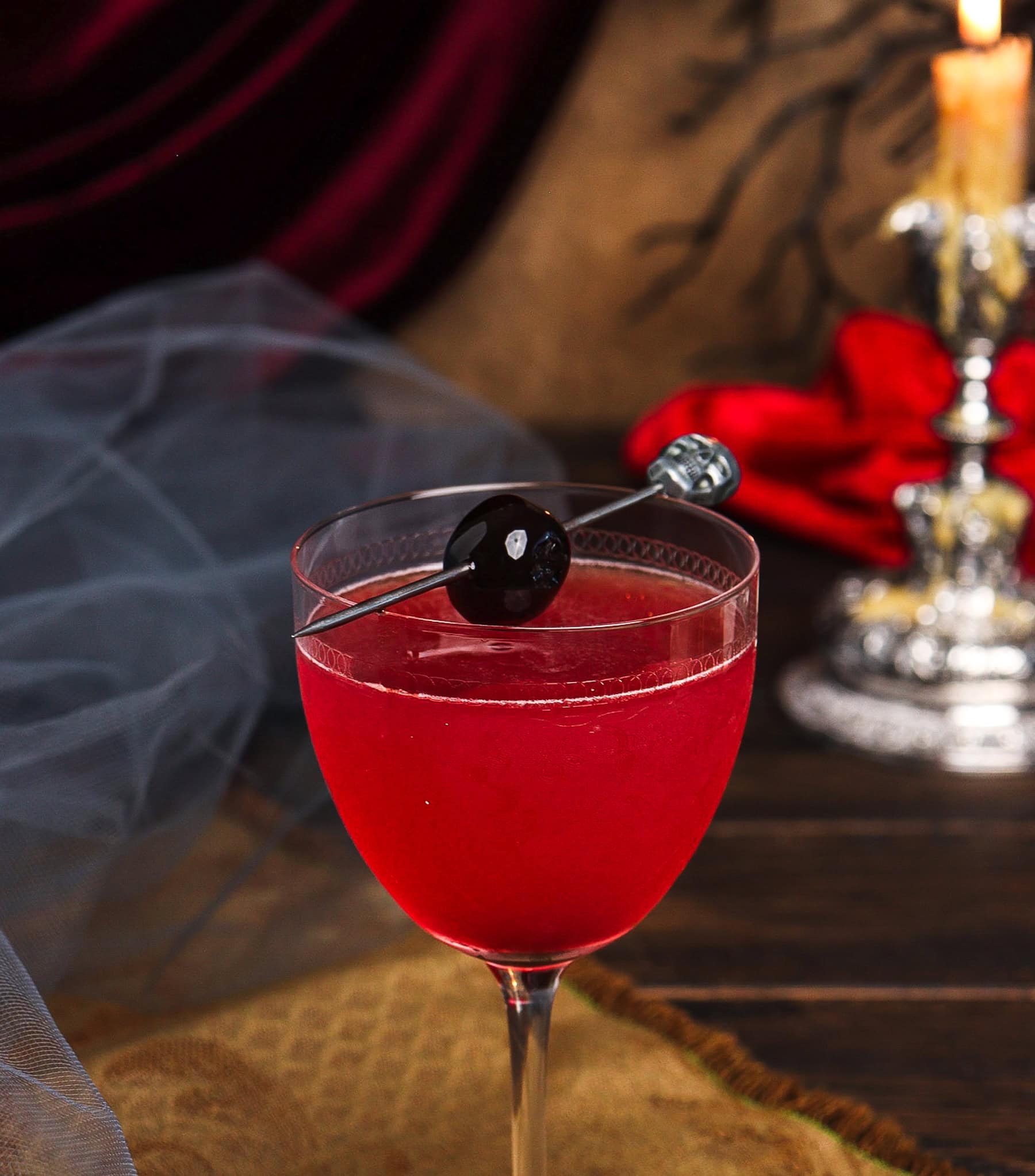 slivovitz cocktail with a luxardo cherry garnish